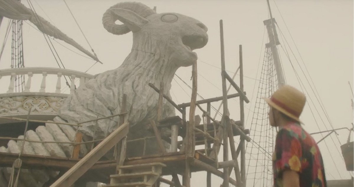 Luffy looks up at the Going Merry ram figurehead on the practical set of Netflix One Piece live action