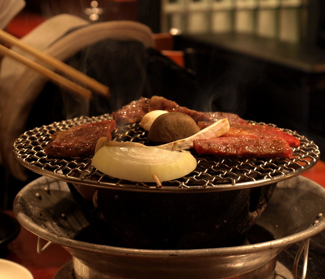 Japanese yakiniku grilled meat on shichirin charcoal brazier