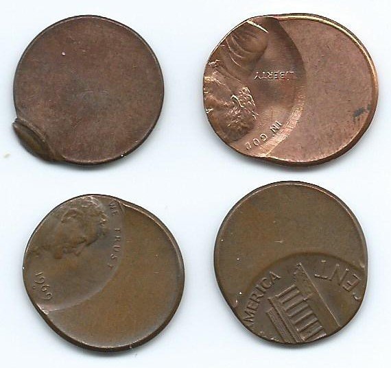 Clipped and off-center error cents showing mint production defects