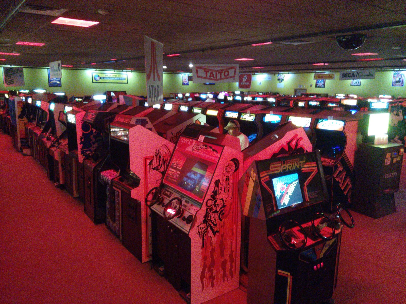 Interior of the American Classic Arcade Museum showing rows of vintage arcade cabinets ready to play