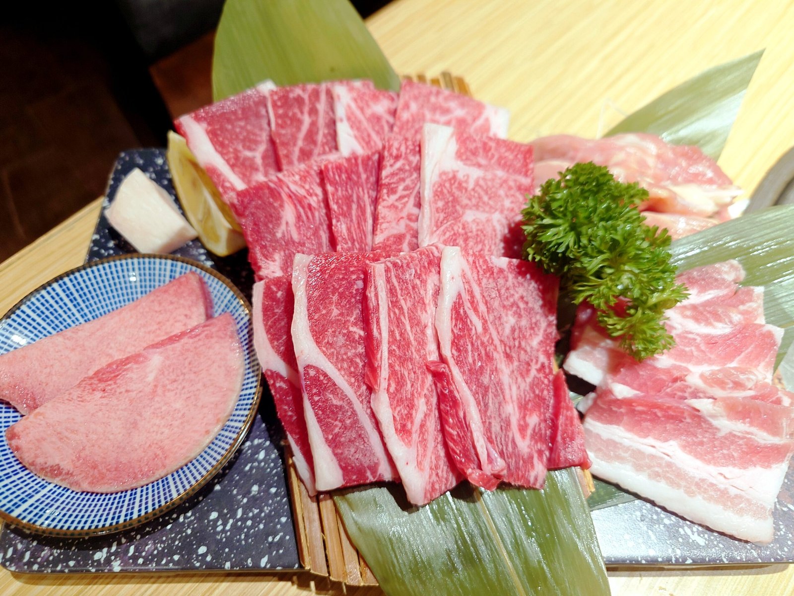 Mixed raw beef pork chicken yakiniku Japanese BBQ spread