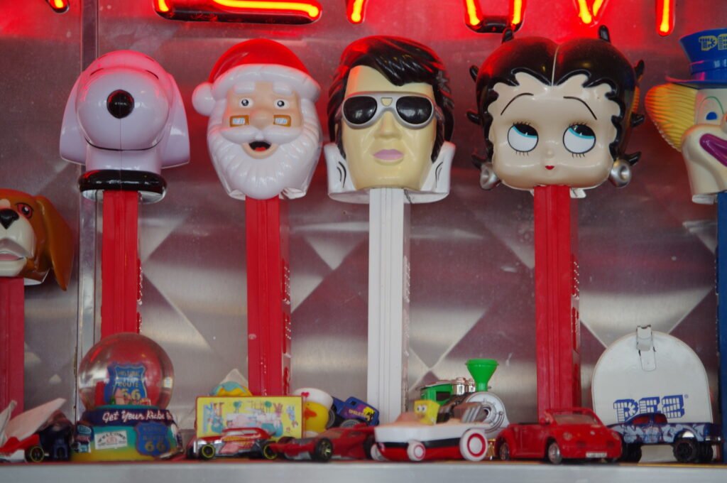 A large collection of vintage PEZ dispensers on display