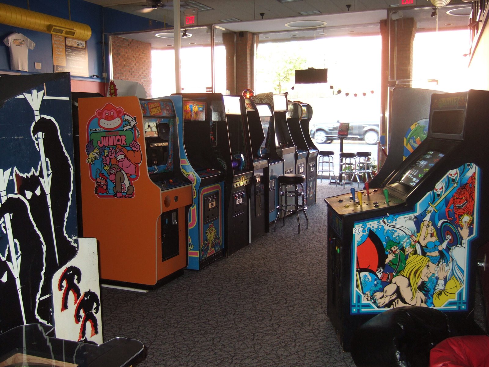 People playing pinball and classic arcade games at Yestercades arcade in Red Bank New Jersey