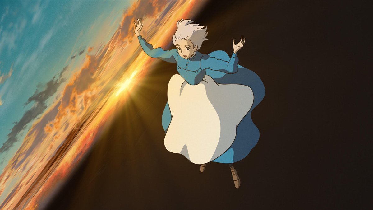 Sophie flying through a sunset sky in Howl’s Moving Castle