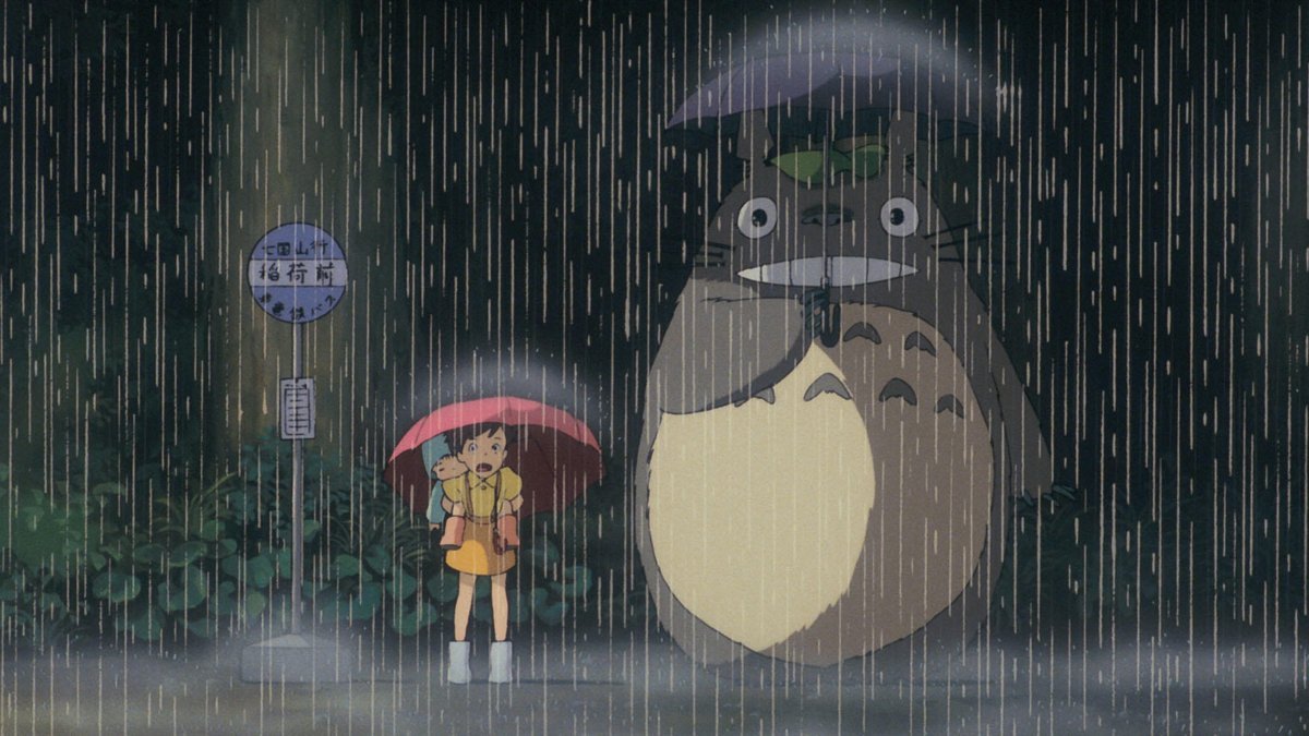 Satsuki and Totoro at the rainy bus stop in My Neighbor Totoro