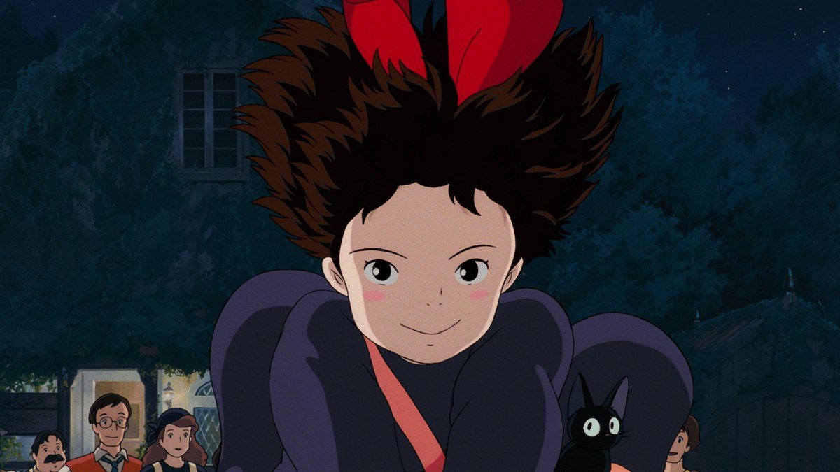 Kiki flying on her broom at night with Jiji in Kiki’s Delivery Service