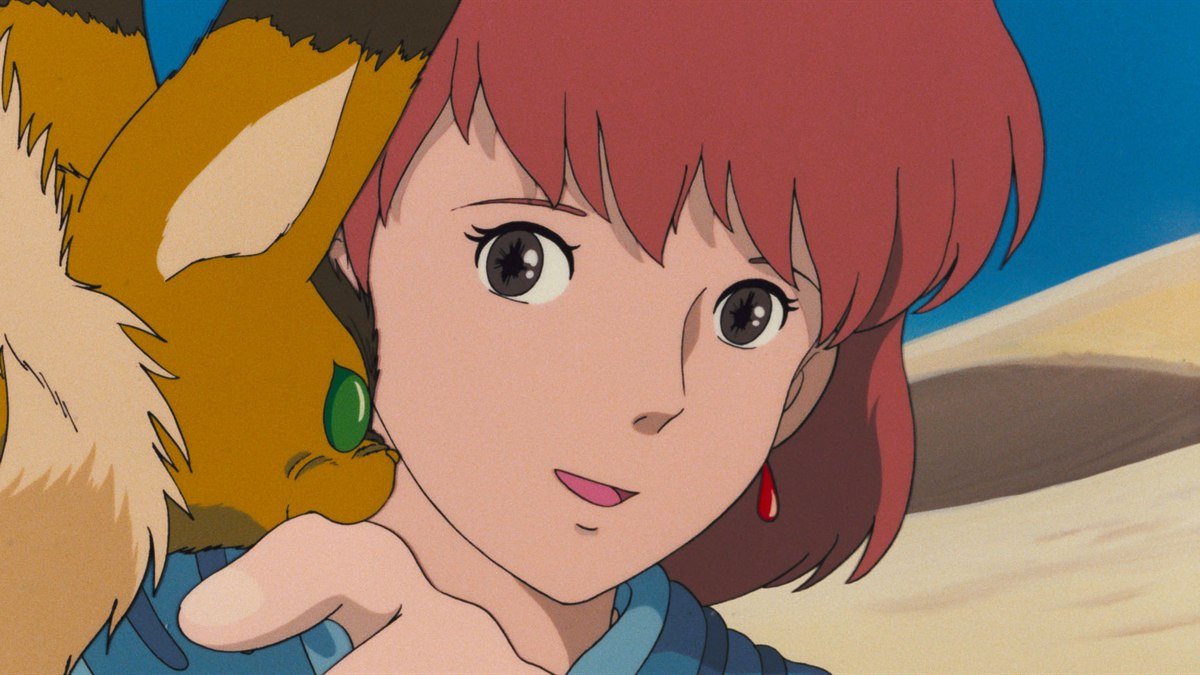 Nausicaä smiling with her fox-squirrel Teto in Nausicaä of the Valley of the Wind
