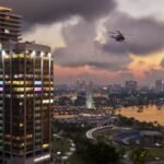 Official GTA 6 screenshot of the Vice City skyline at sunset with a helicopter overhead