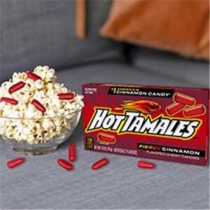 Hot Tamales Fierce Cinnamon chewy candy box with a bowl of popcorn