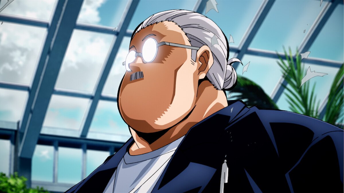 First-look still from Sakamoto Days Season 2 showing a man with glasses and a gray ponytail under a glass roof