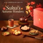 Sakuraco November 2026 Sakai's Autumn Wonders box with sweet potato yokan, konpeito, squid senbei, maple-leaf senbei, hojicha and lacquered chopsticks