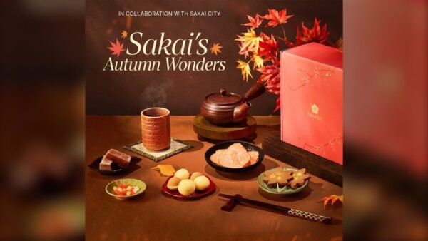 Sakuraco November 2026 Sakai's Autumn Wonders box with sweet potato yokan, konpeito, squid senbei, maple-leaf senbei, hojicha and lacquered chopsticks