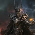 Iron Studios Sauron Unleashed statue of Sauron in spiked armor in front of a volcano, with the One Ring glowing above his hand