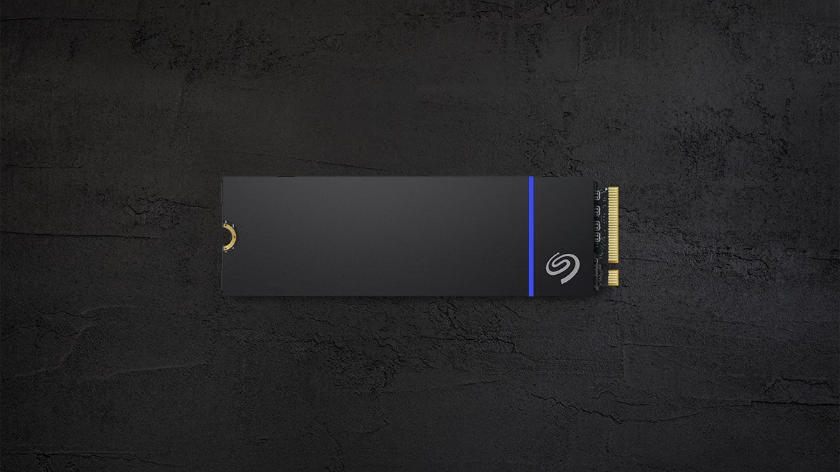 Seagate Game Drive PS5 NVMe SSD with its heatsink, seen from above on a dark stone surface