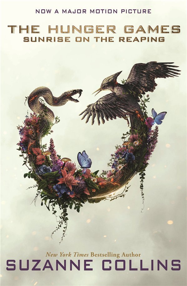 Sunrise on the Reaping movie tie-in edition cover with the film's snake and mockingjay artwork